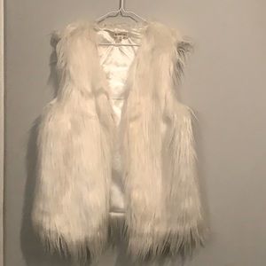 White furry vest